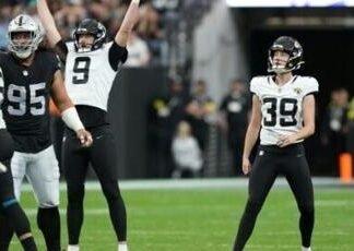 Jacksonville’s Cam Little, right, watches his NFL record-longest 68 yard field goal go through the uprights while teammate Logan Cooke celebrates