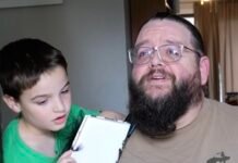 A Secret Santa brings hope to paralyzed dad as wife watches emotional surprise unfold on doorbell camera