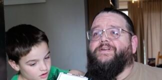 A Secret Santa brings hope to paralyzed dad as wife watches emotional surprise unfold on doorbell camera