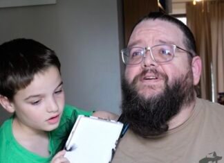 A Secret Santa brings hope to paralyzed dad as wife watches emotional surprise unfold on doorbell camera
