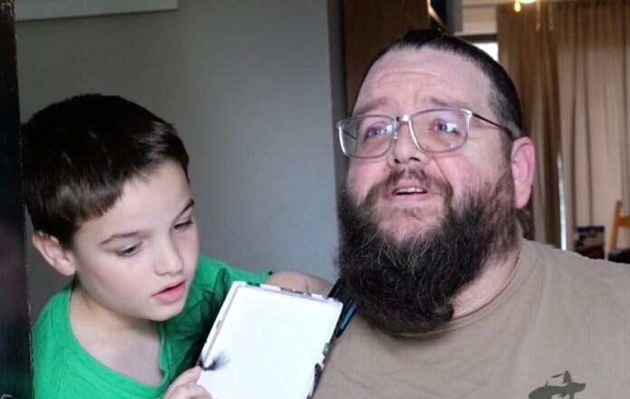A Secret Santa brings hope to paralyzed dad as wife watches emotional surprise unfold on doorbell camera