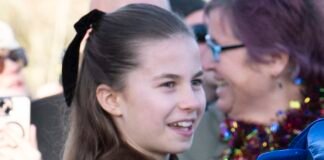 William beams with pride as he watches Charlotte greet well-wishers