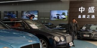 High-end car sales sink in China as its economy slows, taking toll on European automakers