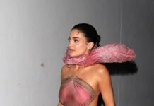 Kylie Jenner’s Pink and Feathery Festive Look Comes With a Fun Reference