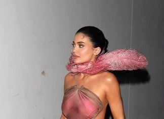 Kylie Jenner’s Pink and Feathery Festive Look Comes With a Fun Reference