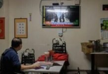 A man in Taiwan watches TV news coverage of the Chinese People’s Liberation Army military drills this week, which Taipei called ‘highly provocative’
