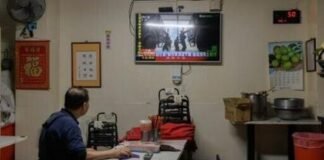 A man in Taiwan watches TV news coverage of the Chinese People’s Liberation Army military drills this week, which Taipei called ‘highly provocative’
