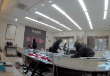 Video shows masked robbers crash car through jewelry store entrance, steal owner’s gun in brazen heist