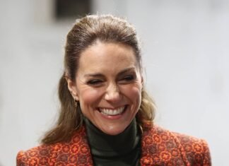 Kate stuns in bespoke tapestry coat and Victoria Beckham trousers