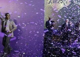 Former head coach Pat Riley watches as the Los Angeles Lakers unveil his statue outside Crypto.com Arena