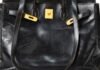 Why worn-out designer handbags are the ultimate status symbols