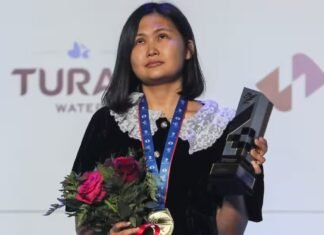 What does GM Bibisara Assaubayeva carry in her champion handbag?
