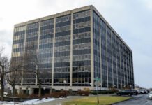 Albany-area boss loses pay over cash, luxury bag