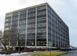 Albany-area boss loses pay over cash, luxury bag