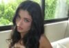 Kylie Jenner strips to her bra on the sofa as she flaunts $1m handbag collection