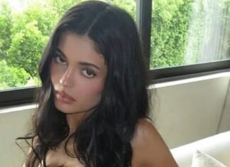 Kylie Jenner strips to her bra on the sofa as she flaunts $1m handbag collection