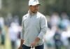 Two-time major winner Xander Schauffele watches at the 15th green during a practice round ahead of the 90th Masters