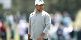 Two-time major winner Xander Schauffele watches at the 15th green during a practice round ahead of the 90th Masters