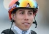 Irad Ortiz Jr., jockey of Kentucky Derby favorite Renegade, watches in the barn area at Churchill Downs after morning workouts ahead of the 152nd Run for the Roses
