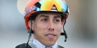Irad Ortiz Jr., jockey of Kentucky Derby favorite Renegade, watches in the barn area at Churchill Downs after morning workouts ahead of the 152nd Run for the Roses