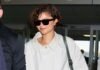 Zendaya Doesn’t Do Leggings and Sneakers at the Airport—She Wears This Skirt Trend With It Flats