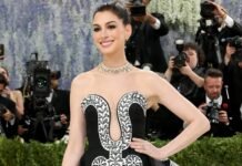 Anne Hathaway Stuns in Hand-Painted Michael Kors Gown Paired with a Bulgari High Jewelry Necklace