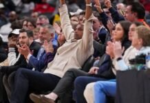 Charles Barkley watches the game Sunday, April 5, 2026, during the NIT men’s basketball championship game at Gainbridge Fieldhouse in Indianapolis.