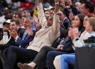 Charles Barkley watches the game Sunday, April 5, 2026, during the NIT men’s basketball championship game at Gainbridge Fieldhouse in Indianapolis.