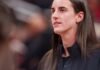 Indiana Fever guard Caitlin Clark (22) watches as her team mates warm up as the Portland Fire face the Indiana Fever Wednesday, May 20, 2026, at the Gainbridge Fieldhouse in Indianapolis.