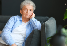 Boomers who watch hours of TV a day are often grieving the specific kind of company a long marriage used to provide — the running commentary of a shared life — and the news anchor who reliably appears at the same hour is the partner who still shows up at the table on time