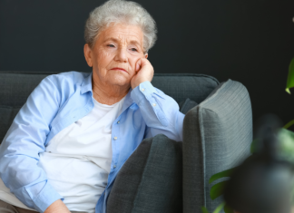 Boomers who watch hours of TV a day are often grieving the specific kind of company a long marriage used to provide — the running commentary of a shared life — and the news anchor who reliably appears at the same hour is the partner who still shows up at the table on time