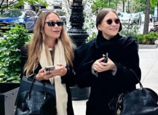 Mary-Kate and Ashley Olsen make a rare appearance wearing coordinated handbags and coats, and serving classic Olsen style