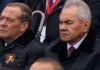 War chief ‘plotting coup against Putin’ frowns as he watches paranoid tyrant’s drastically scaled-back flagship parade