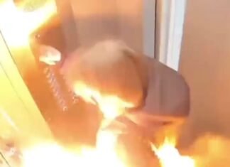 Nightmarish moment woman’s power bank bursts into flames in her handbag while she’s trapped in tiny lift