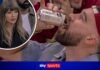 Taylor Swift watches on as Travis Kelce downs a beer in one ahead of the NBA game between NY Knicks and Cleveland Cavaliers!