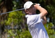 George McNeill of Fort Myers, Florida, watches his tee shot on the par three, 6th hole. The second round of the Senior PGA