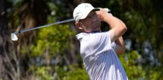 George McNeill of Fort Myers, Florida, watches his tee shot on the par three, 6th hole. The second round of the Senior PGA