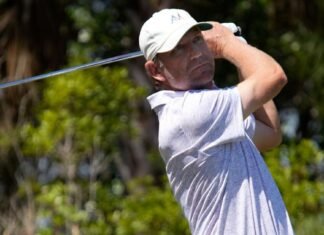 George McNeill of Fort Myers, Florida, watches his tee shot on the par three, 6th hole. The second round of the Senior PGA