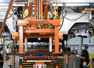 Automakers and workers face existential fight over robots, future