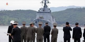 Kim watches Kang Kon destroyer set sail