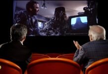 Steven Spielberg watches scene from “Close Encounters of the Third Kind”