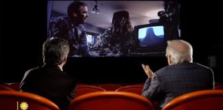 Steven Spielberg watches scene from “Close Encounters of the Third Kind”