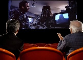 Steven Spielberg watches scene from “Close Encounters of the Third Kind”