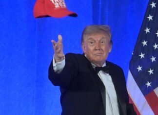 Trump defends his sweeping tariffs and watches ‘America First’ drag races during Michigan stop