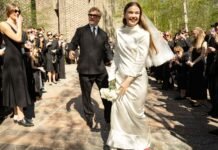 Inside a stylish Stockholm wedding with a brutalist church, bespoke fashion and vintage red shoes