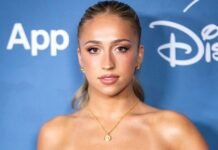 Tate McRae Elevates High-Slit Cutout Dress With Luxe Versace Jewelry