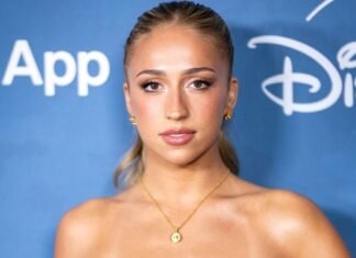 Tate McRae Elevates High-Slit Cutout Dress With Luxe Versace Jewelry